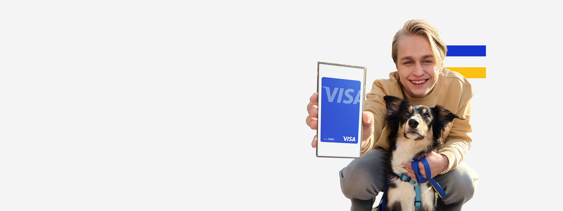 Man and dog showing Visa card on his phone